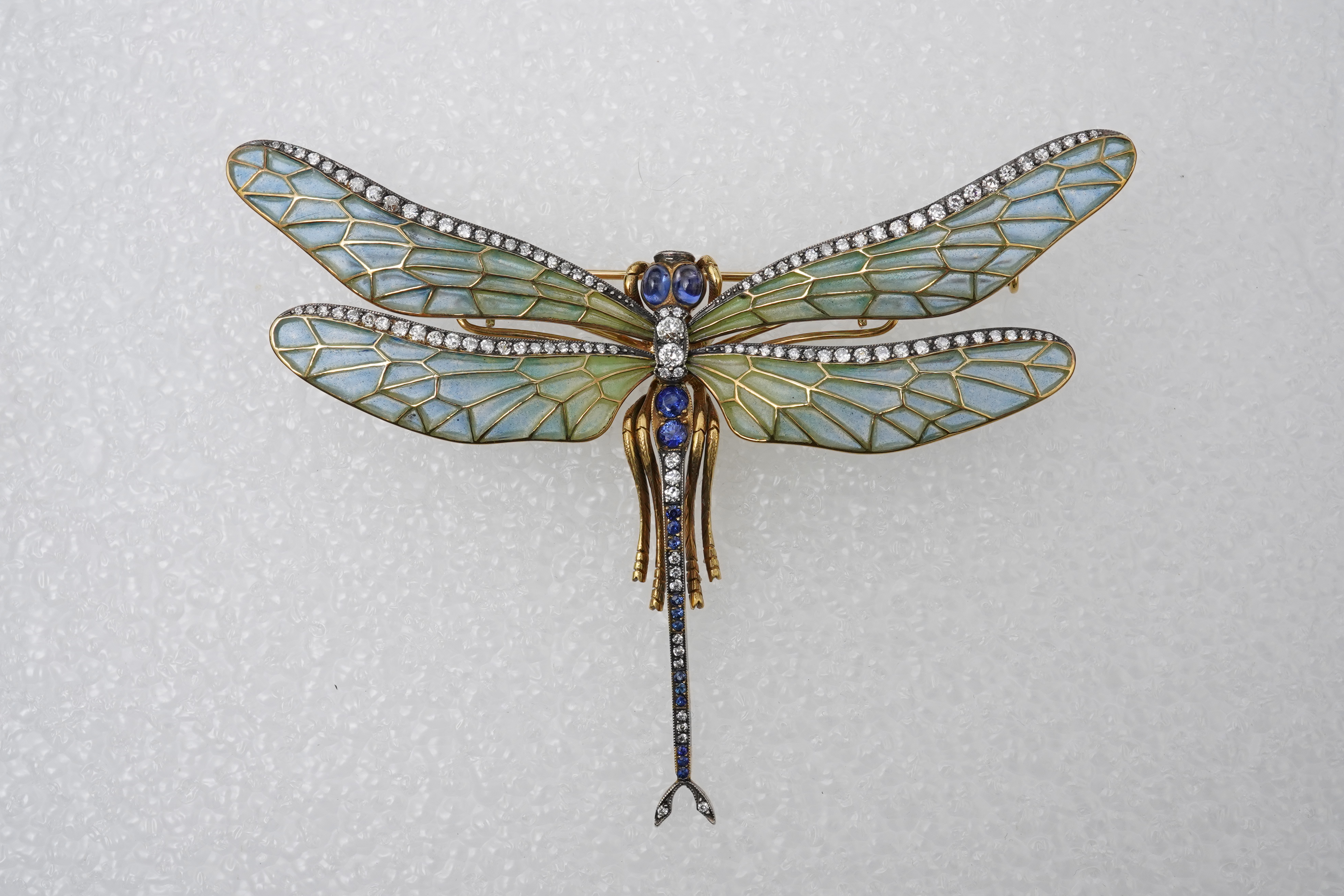 An enamel, sapphire and diamond dragonfly brooch